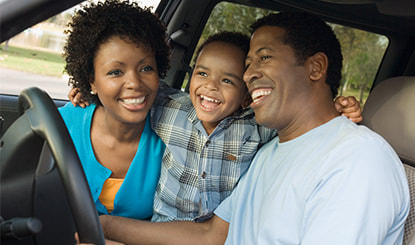 African American family inside the car